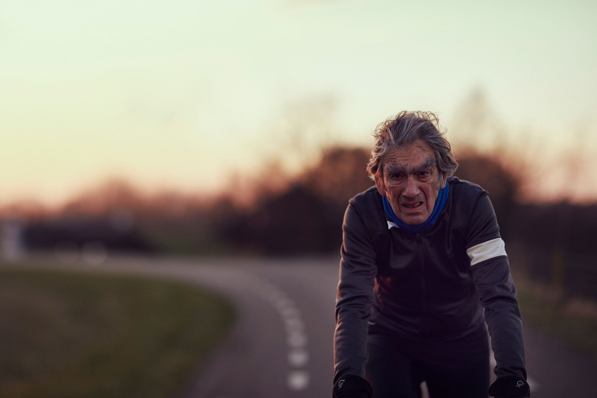 Albert riding towards the camera at sunset