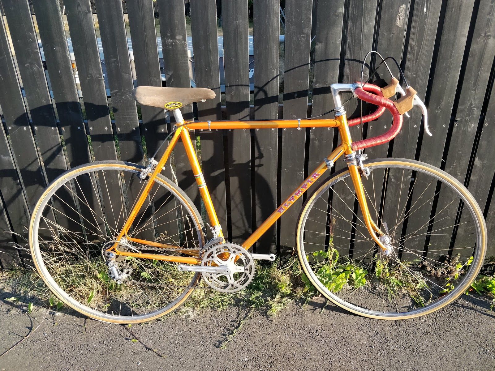 Orange 1978 Olympia racing bicycle seen from the drive side