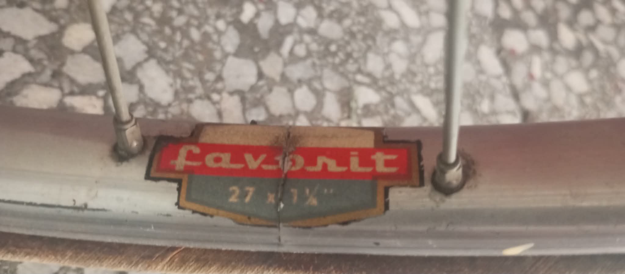 Worn Favorit label on the bicycle rim