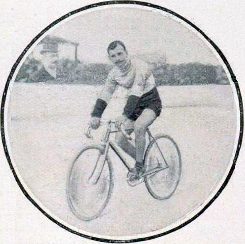 Gustave Garrigou standing with his Alcyon racing bicycle in 1911.