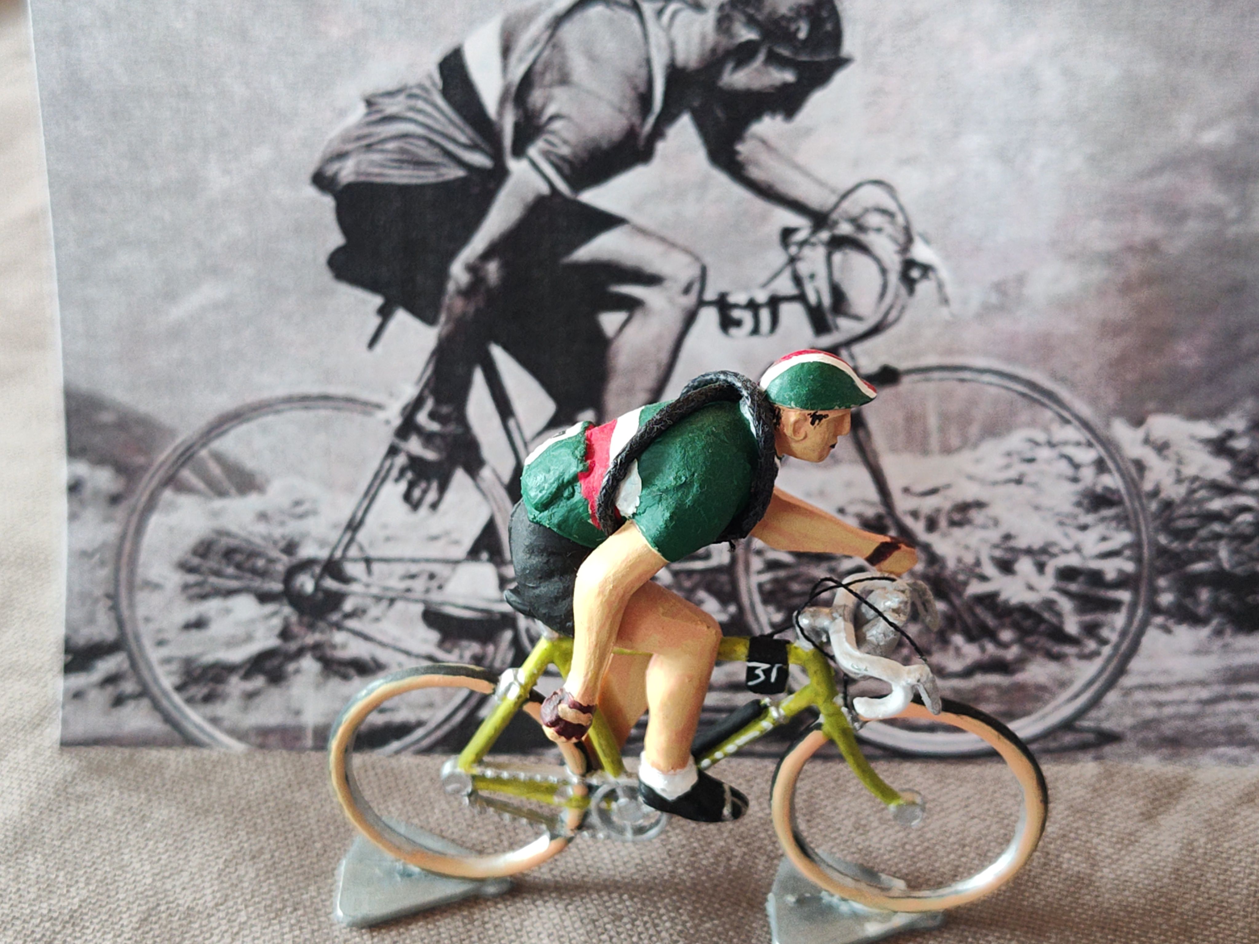 Hand-decorated miniature cyclist in green, white and red