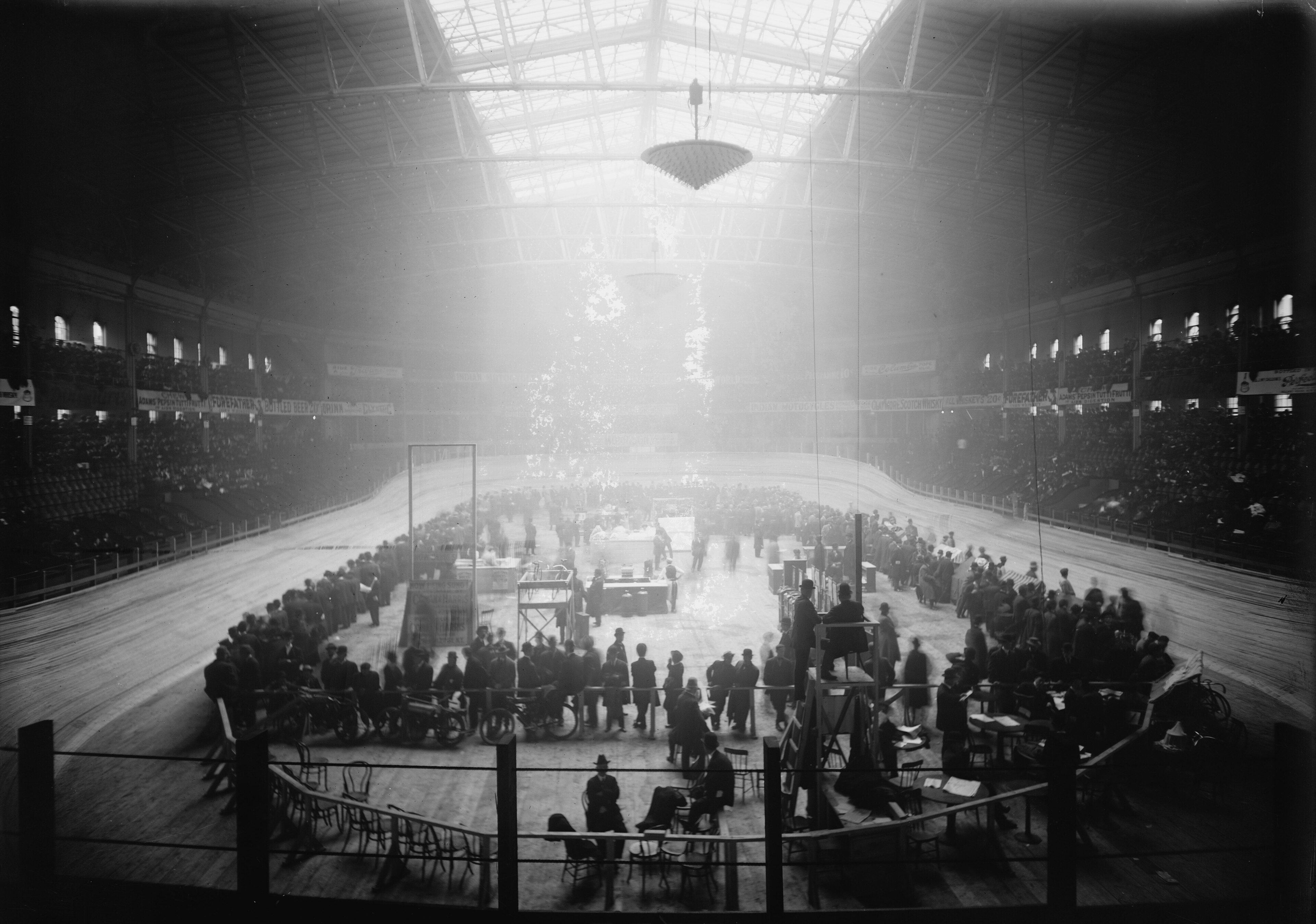 A large indoor cycle track and crowd at Madison Square Garden