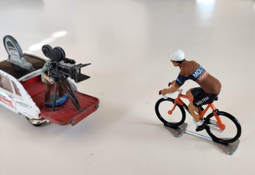 Molteni miniature cyclist riding past a small camera car