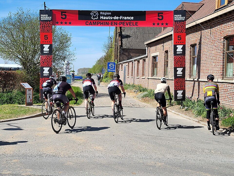 Entrance to the cobbled sector at Camphin-en-Pévèle during the 2025 Paris–Roubaix Challenge
