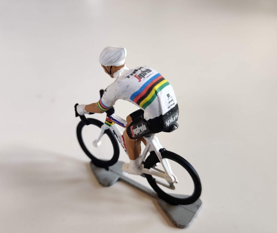 Later miniature cyclist in a white world champion jersey