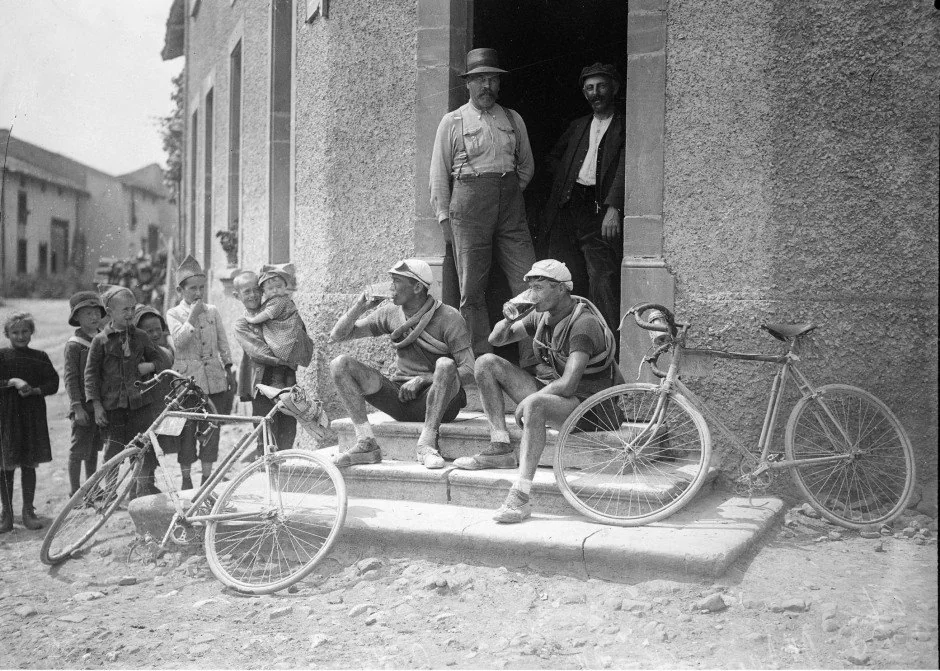 Henri Colle and Charles Parel resting with their bicycles